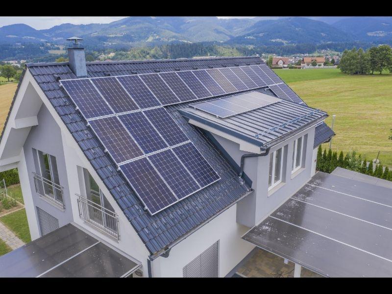 aerial view private house with solar panels roof 1